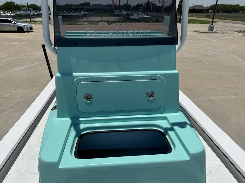 Slide: The Image of Turquoise Shoalwater 23' Catamaran from 2026 on a parking lot. - 16