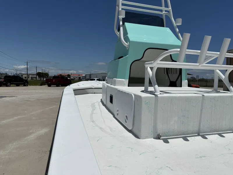 Slide: The Image of 2026 Shoalwater 23' Catamaran on a parking lot under sunny skies. - 19