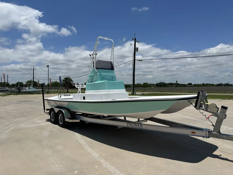 Slide: The Image of 2026 Shoalwater 23' Catamaran on trailer under sunny skies. - 5