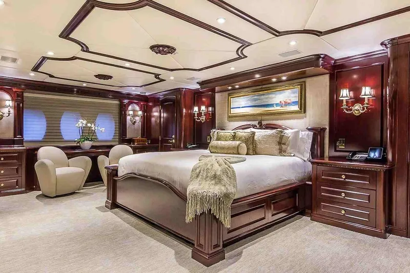 Slide: The Image of Luxurious bedroom interior on 2003 Trinity Yachts Motoryacht with elegant wood finishes. - 17