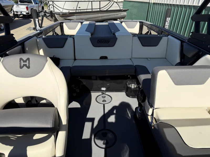 Slide: The Image of Interior of 2023 Heyday WTSurf boat with beige seating. - 13