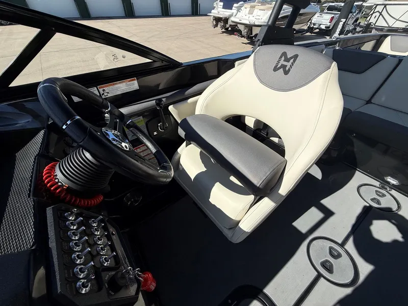 Slide: The Image of Interior of a 2023 Heyday WTSurf boat with steering and seat. - 14