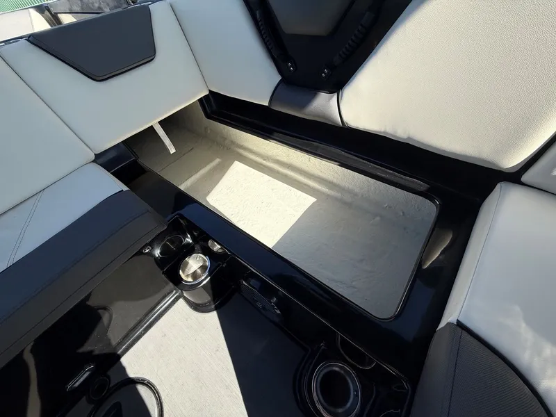 Slide: The Image of Interior of 2023 Heyday WTSurf boat with storage compartment. - 28