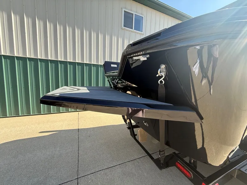 Slide: The Image of Rear view of a 2023 Heyday WTSurf boat on a trailer. - 6