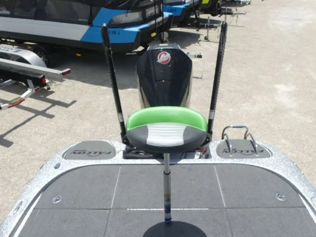 Slide: The Image of 2022 Falcon Bass Boats F21 TE with green seat on deck. - 21