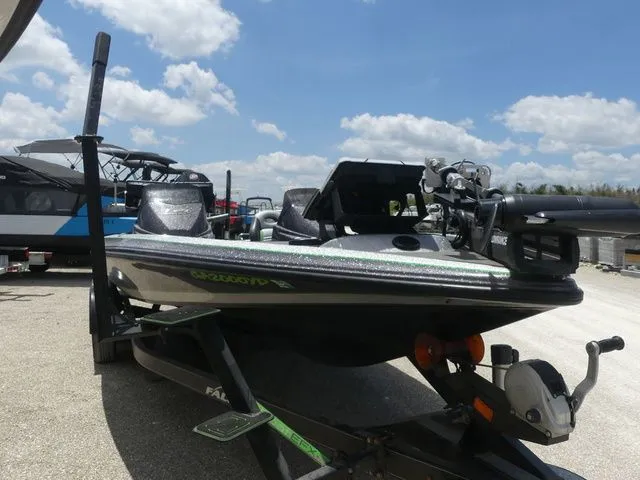 Slide: The Image of 2022 Falcon Bass Boats F21 TE on trailer under blue sky. - 3