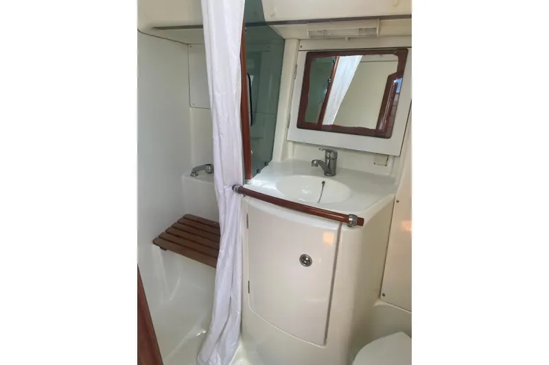 Slide: The Image of Bathroom interior of 2002 Beneteau Oceanis Clipper 361 yacht, featuring sink and shower. - 11