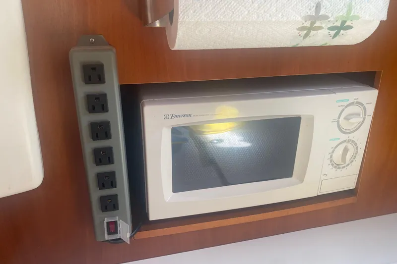 Slide: The Image of Microwave and power strip in 2002 Beneteau Oceanis Clipper 361 yacht kitchen. - 12