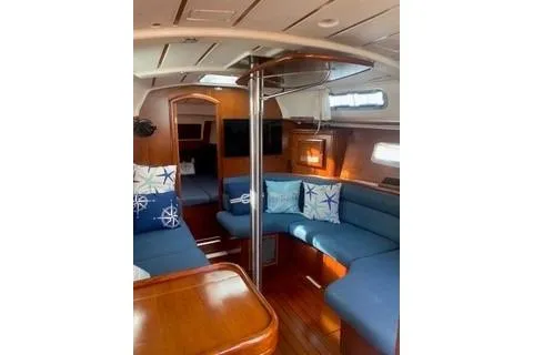 Slide: The Image of Interior of 2002 Beneteau Oceanis Clipper 361 yacht with blue seating and nautical decor. - 15