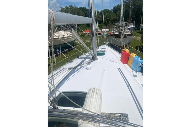 Slide: The Image of 2002 Beneteau Oceanis Clipper 361 sailboat deck with colorful fuel containers. - 3
