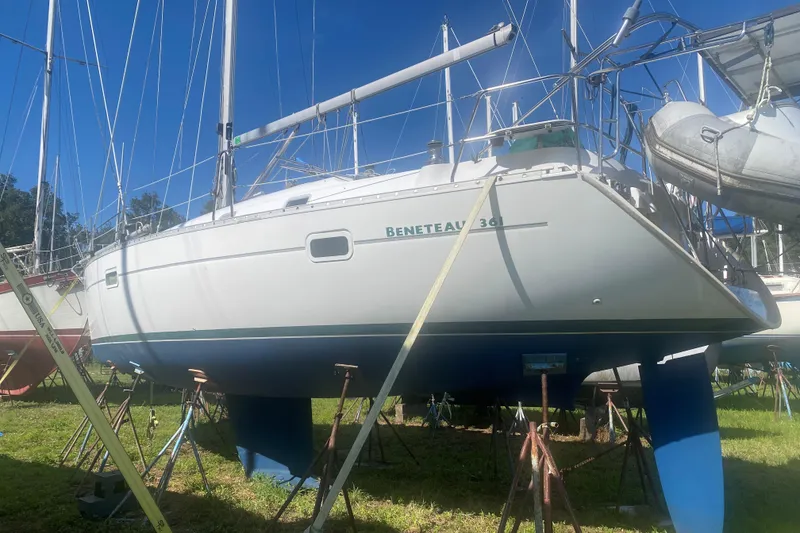 Slide: The Image of 2002 Beneteau Oceanis Clipper 361 sailboat on stands, displayed outdoors. - 33