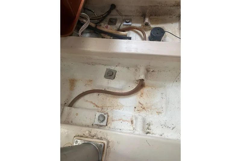 Slide: The Image of Bilge area of 2002 Beneteau Oceanis Clipper 361 sailboat, showing hoses and fittings. - 37