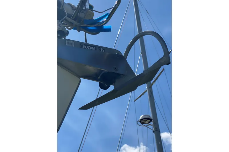 Slide: The Image of Rocna anchor on 2002 Beneteau Oceanis Clipper 361 sailboat under clear blue sky. - 38