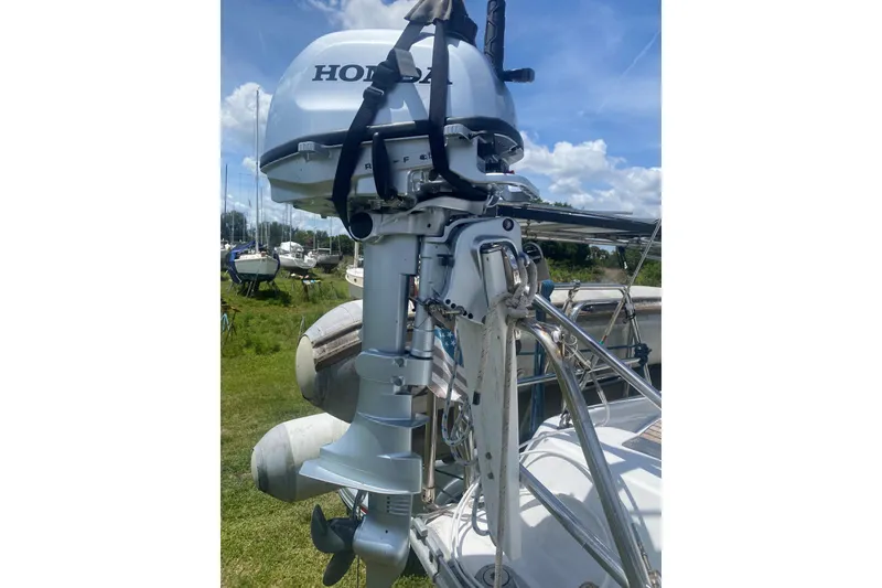 Slide: The Image of Outboard motor on a 2002 Beneteau Oceanis Clipper 361 sailboat, docked outdoors. - 40