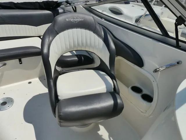 Slide: The Image of 2016 Stingray 214 LR boat seat with black and white upholstery. - 11