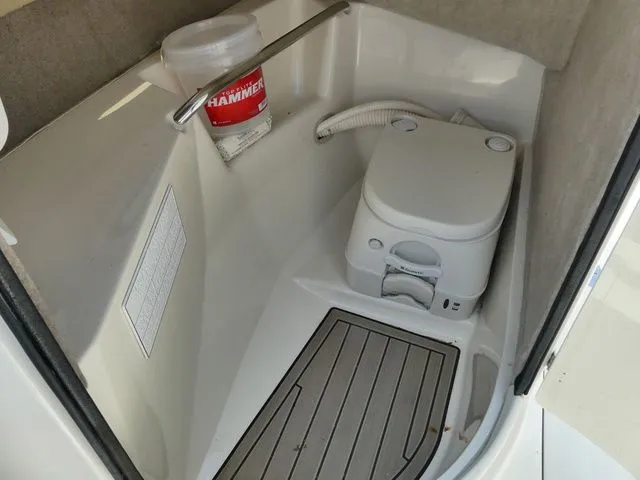 Slide: The Image of Interior of a 2016 Stingray 214 LR with portable toilet. - 13