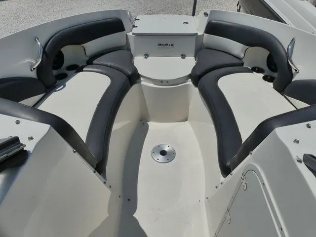 Slide: The Image of Interior view of a 2016 Stingray 214 LR boat with seating area. - 14