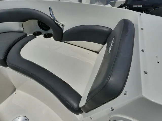 Slide: The Image of Interior of a 2016 Stingray 214 LR boat with gray seating. - 16