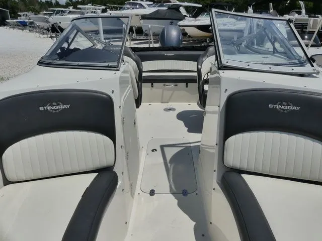 Slide: The Image of Interior of a 2016 Stingray 214 LR boat with seating. - 17