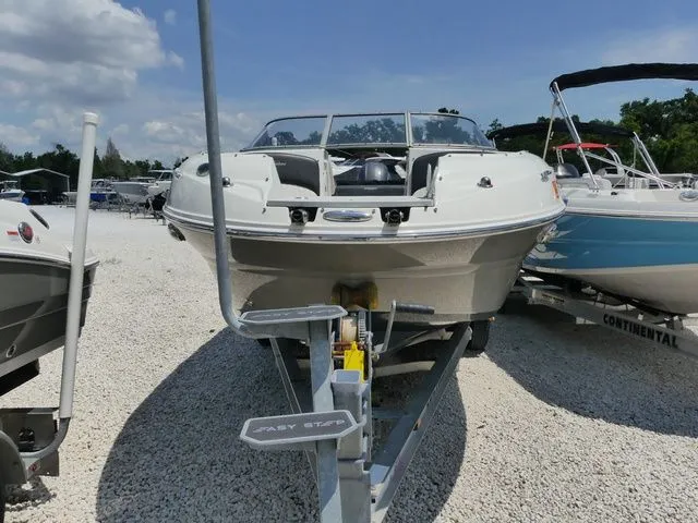 Slide: The Image of 2016 Stingray 214 LR boat on trailer, sunny day. - 3