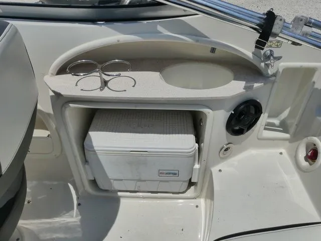 Slide: The Image of Interior of 2016 Stingray 214 LR with cooler and cup holders. - 7