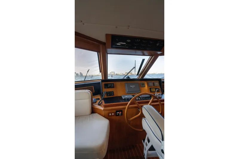 Slide: The Image of Pilothouse interior of 2005 Symbol 58 yacht with navigation equipment and steering wheel. - 21