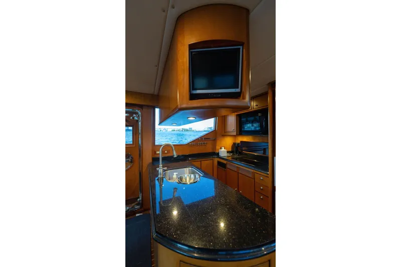Slide: The Image of Luxurious kitchen interior of 2005 Symbol 58 Pilothouse yacht with modern amenities. - 22