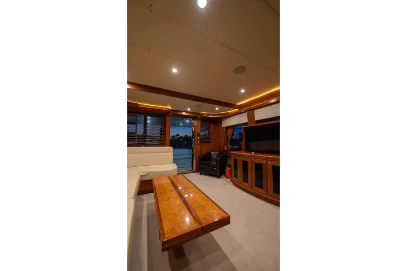 Slide: The Image of Luxurious interior of a 2005 Symbol 58 Pilothouse yacht with elegant wood finishes. - 27