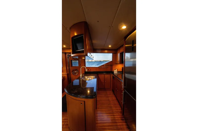 Slide: The Image of Luxurious kitchen interior of 2005 Symbol 58 Pilothouse yacht with wood finish and ocean view. - 30