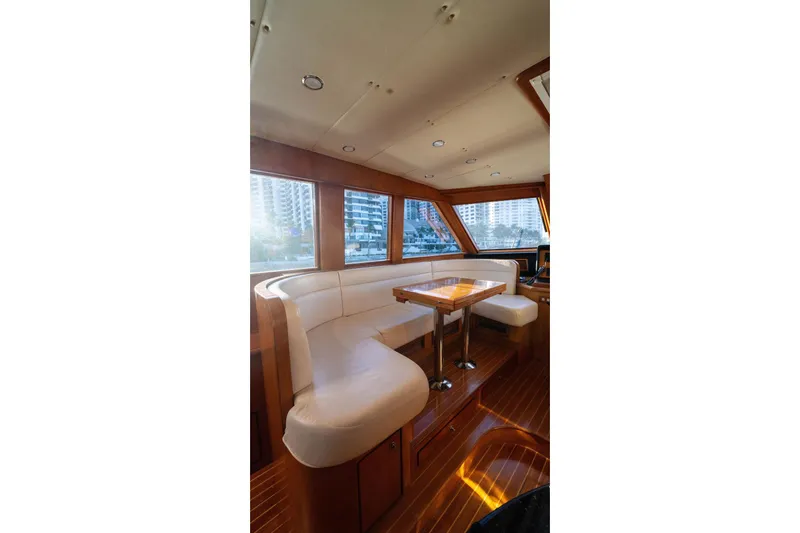 Slide: The Image of Luxurious interior of 2005 Symbol 58 Pilothouse yacht with elegant seating and wooden finishes. - 33