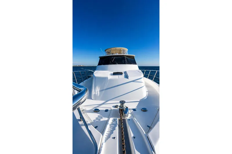 Slide: The Image of 2005 Symbol 58 Pilothouse yacht on open sea under clear blue sky. - 37