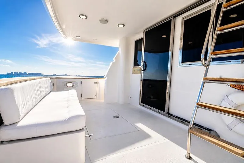 Slide: The Image of Luxurious 2005 Symbol 58 Pilothouse yacht deck with seating and ocean view. - 38