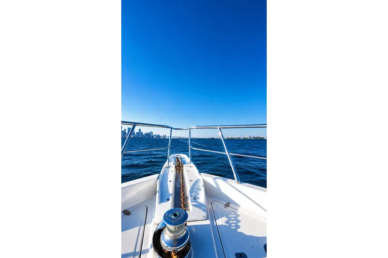 Slide: The Image of Bow view of 2005 Symbol 58 Pilothouse yacht cruising on open water. - 40