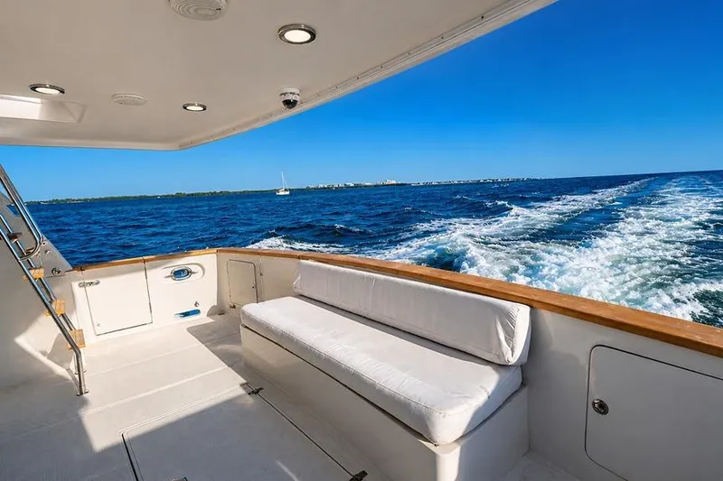 Slide: The Image of Luxurious 2005 Symbol 58 Pilothouse yacht cruising on open blue sea. - 42