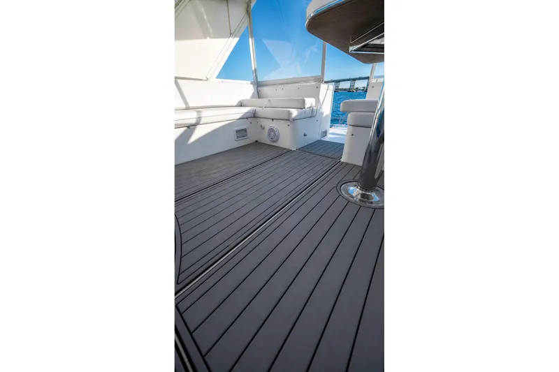 Slide: The Image of Luxurious deck of 2005 Symbol 58 Pilothouse yacht with sleek seating and ocean view. - 46