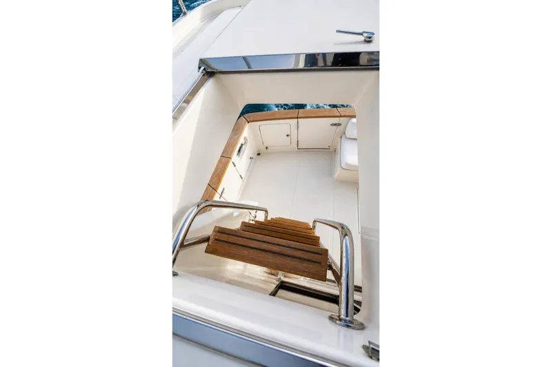 Slide: The Image of Staircase leading to the deck of a 2005 Symbol 58 Pilothouse yacht. - 59