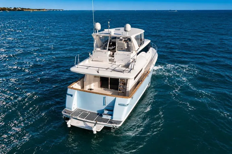 Slide: The Image of 2005 Symbol 58 Pilothouse yacht cruising on open blue sea. - 6