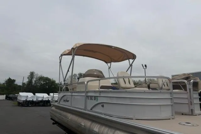 Slide: The Image of 2016 SunChaser Oasis Fish 820 Cruise-N-Fish pontoon boat with canopy in a parking lot. - 10