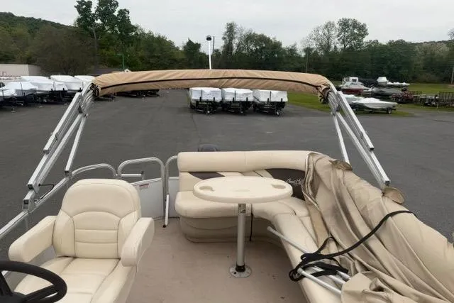 Slide: The Image of 2016 SunChaser Oasis Fish 820 Cruise-N-Fish pontoon boat with beige seating and canopy. - 12