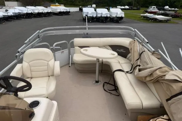 Slide: The Image of 2016 SunChaser Oasis Fish 820 Cruise-N-Fish pontoon boat with beige seating and table. - 6