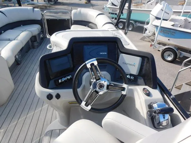 Slide: The Image of Interior view of 2020 Avalon Ambassador Funship 27' with helm console. - 12