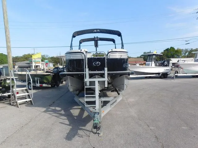 Slide: The Image of 2020 Avalon Ambassador Funship 27' parked on a trailer. - 2