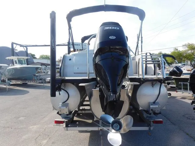 Slide: The Image of Rear view of a 2020 Avalon Ambassador Funship 27' with outboard motor. - 4