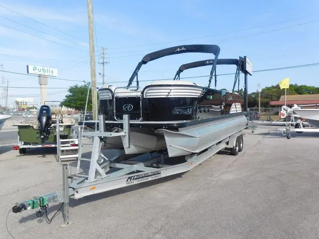 The Image of 2020 Avalon Ambassador Funship 27' on trailer, parking lot view. - 1