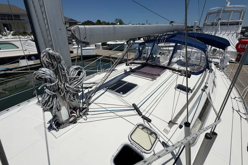 Slide: The Image of 1998 Jeanneau Sun Odyssey 45.2 sailboat docked, showcasing deck and rigging details. - 11