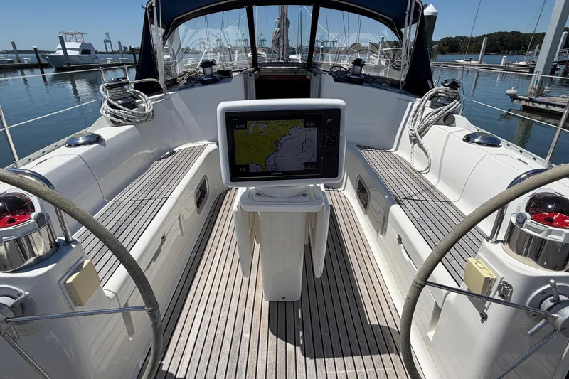 Slide: The Image of Cockpit of 1998 Jeanneau Sun Odyssey 45.2 sailboat with navigation display and dual steering wheels. - 23