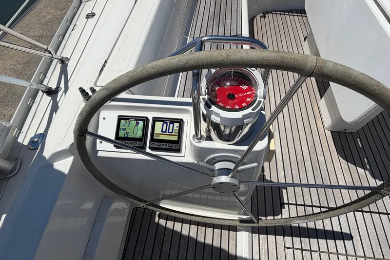 Slide: The Image of Steering wheel and instruments on 1998 Jeanneau Sun Odyssey 45.2 sailboat deck. - 25