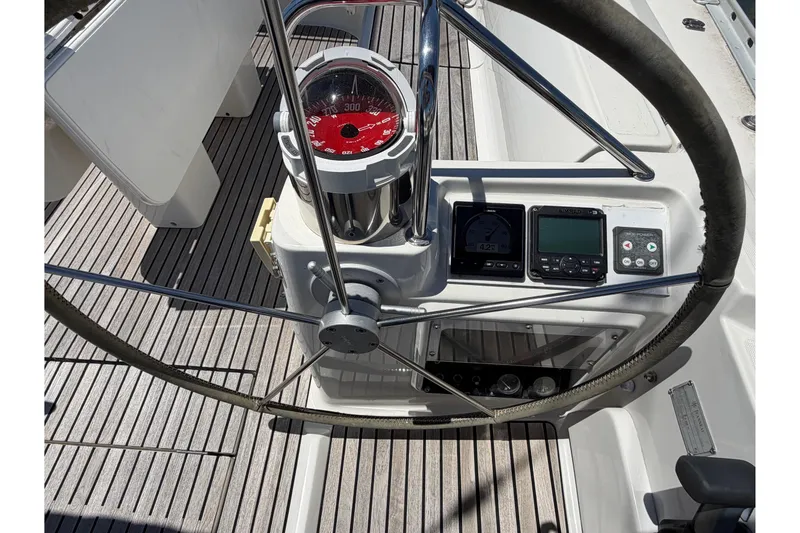 Slide: The Image of Steering wheel and navigation instruments on a 1998 Jeanneau Sun Odyssey 45.2 sailboat. - 26