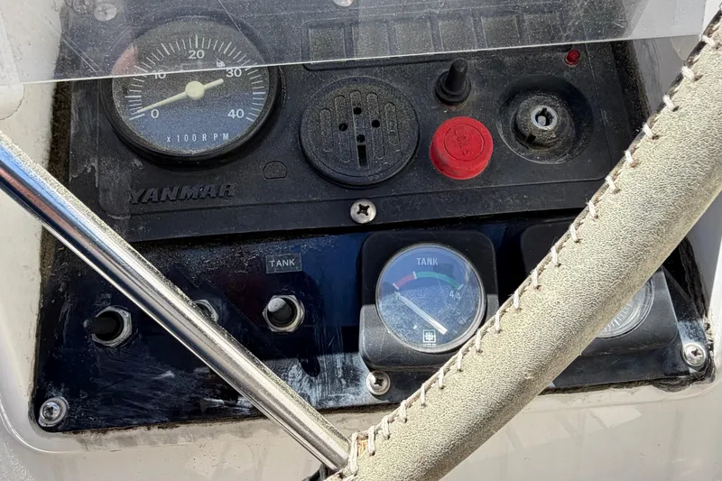 Slide: The Image of Control panel of a 1998 Jeanneau Sun Odyssey 45.2 sailboat, featuring Yanmar gauges. - 27