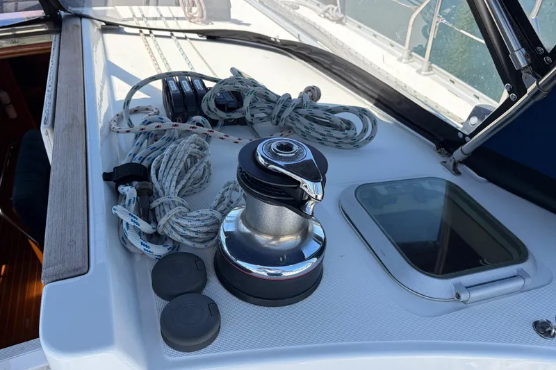 Slide: The Image of Deck of 1998 Jeanneau Sun Odyssey 45.2 with winch, ropes, and hatch. - 30